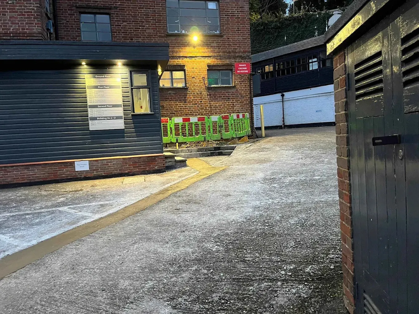 A commercial courtyard with the concrete made good and barriers stood back after the work